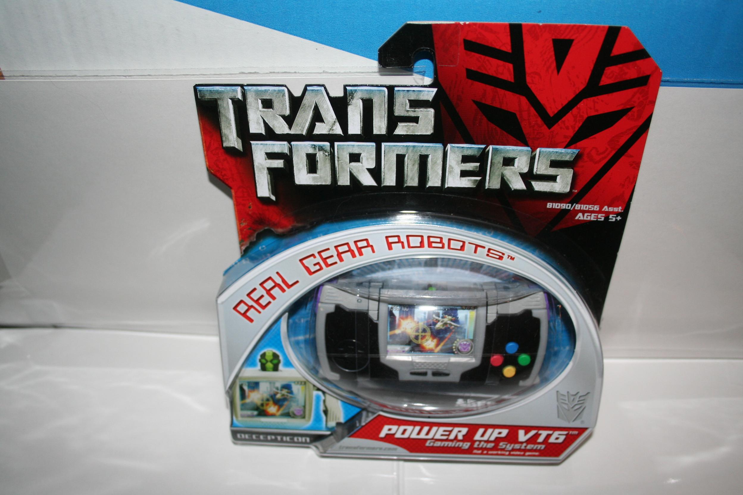 Power up 6. Transformers 2007 игрушки move Hasbro. Transformers real Gear Robots. Робот трансформер камера. Трансформеры игрушки 2007 в коробках.